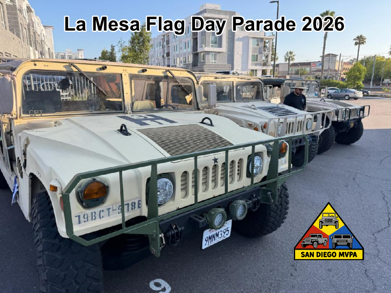 Three Humvees lined up in staging area